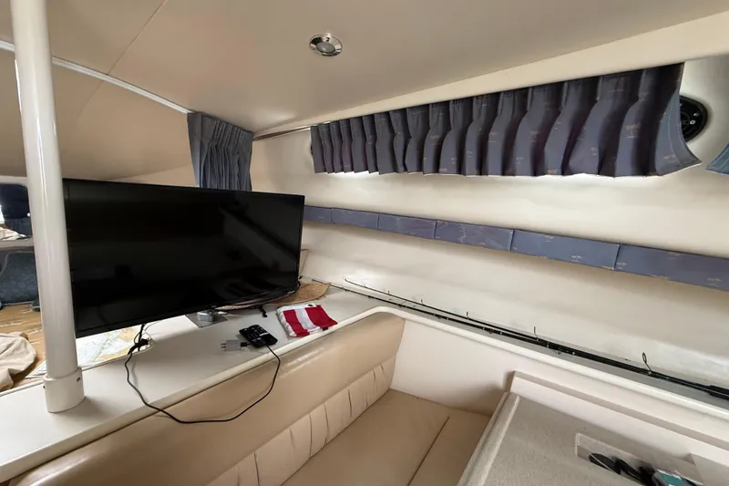 Slide: The Image of Interior of 2004 Wellcraft 330 Coastal boat with TV and seating area. - 21