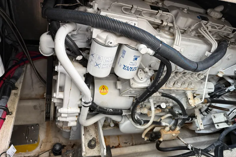 Slide: The Image of Engine compartment of a 2004 Wellcraft 330 Coastal boat, featuring Volvo Penta components. - 22