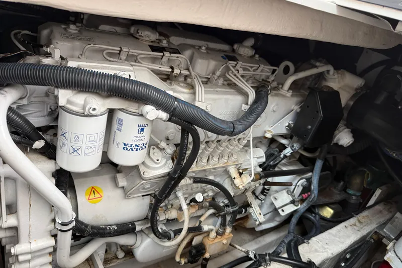 Slide: The Image of Engine compartment of a 2004 Wellcraft 330 Coastal boat, featuring Volvo Penta components. - 23