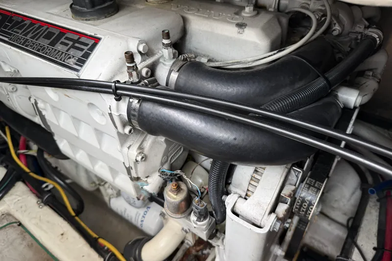 Slide: The Image of Engine compartment of a 2004 Wellcraft 330 Coastal boat, featuring Volvo Penta components. - 24