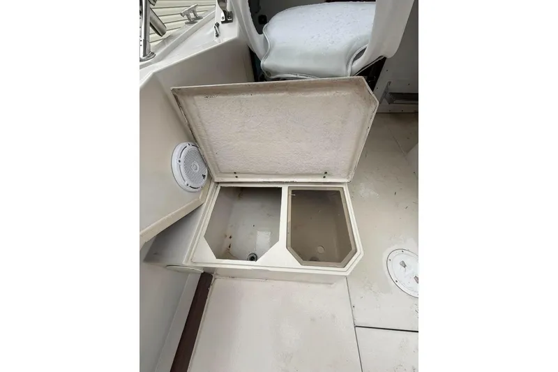 Slide: The Image of Open storage compartment on 1981 Grady-White boat deck, showcasing interior space. - 13