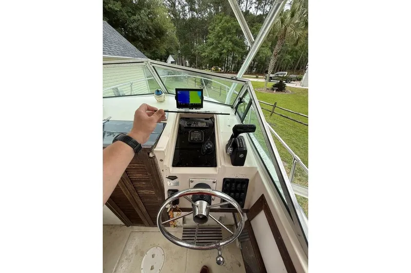 Slide: The Image of Interior view of a 1981 Grady-White Tournament 22 boat with steering console. - 6