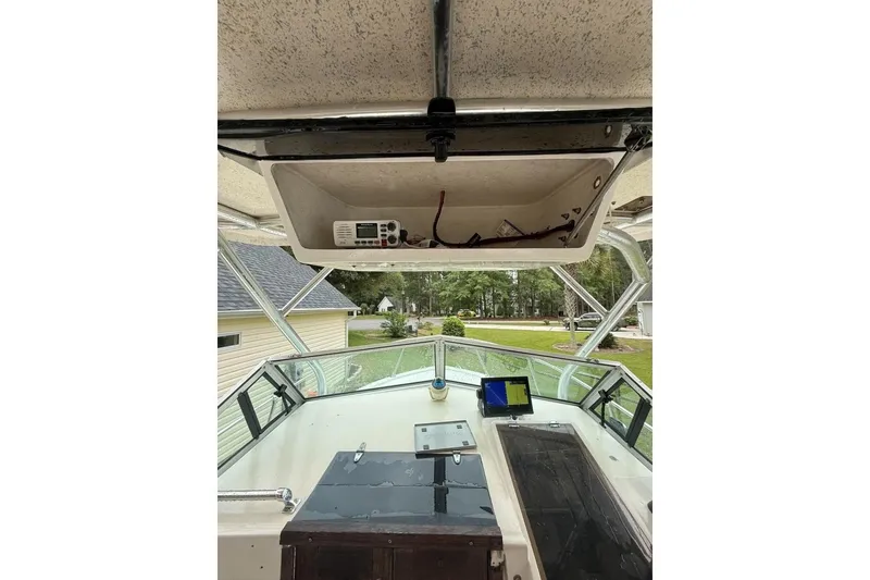 Slide: The Image of Interior view of a 1981 Grady-White boat cockpit with navigation equipment. - 8