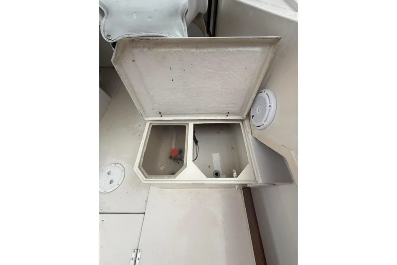 Slide: The Image of Open storage compartment on a 1981 Grady-White boat, showcasing interior details. - 9