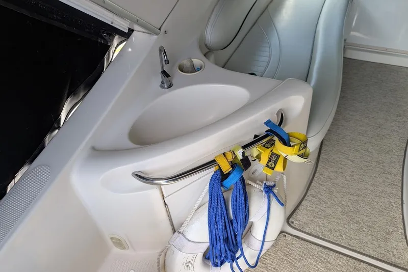 Slide: The Image of Interior of 2002 Maxum 2700 SCR boat with sink and ropes. - 15