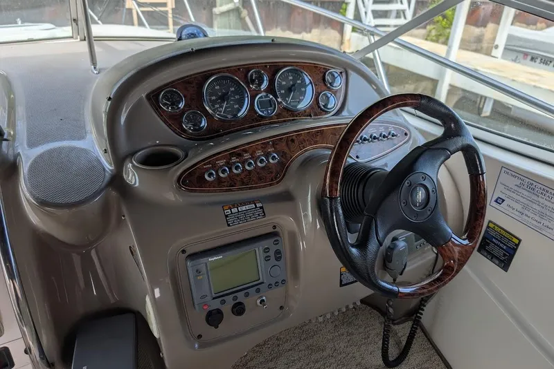 Slide: The Image of Steering console of a 2002 Maxum 2700 SCR boat with gauges and controls. - 20