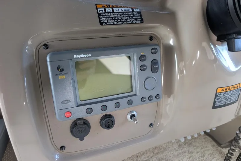 Slide: The Image of Raytheon marine navigation system on 2002 Maxum 2700 SCR boat dashboard. - 21