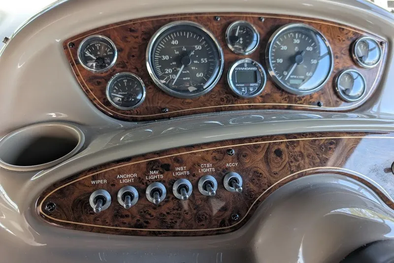 Slide: The Image of Dashboard of a 2002 Maxum 2700 SCR boat with gauges and switches. - 22