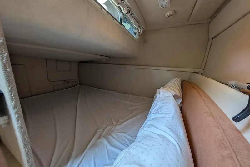 Slide: The Image of Interior cabin of 2002 Maxum 2700 SCR boat with bed and window. - 37
