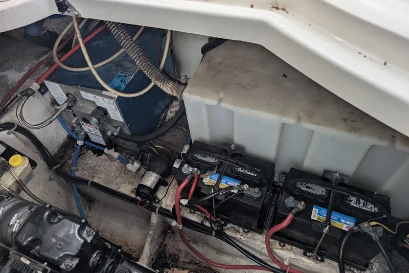 Slide: The Image of Engine compartment of a 2002 Maxum 2700 SCR boat showing batteries and wiring. - 43