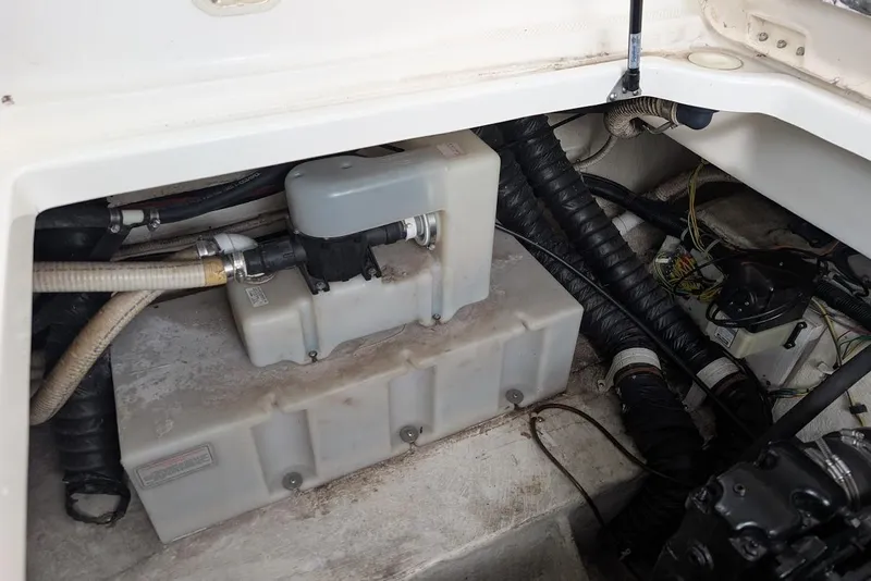 Slide: The Image of Engine compartment of a 2002 Maxum 2700 SCR boat, showing hoses and components. - 44