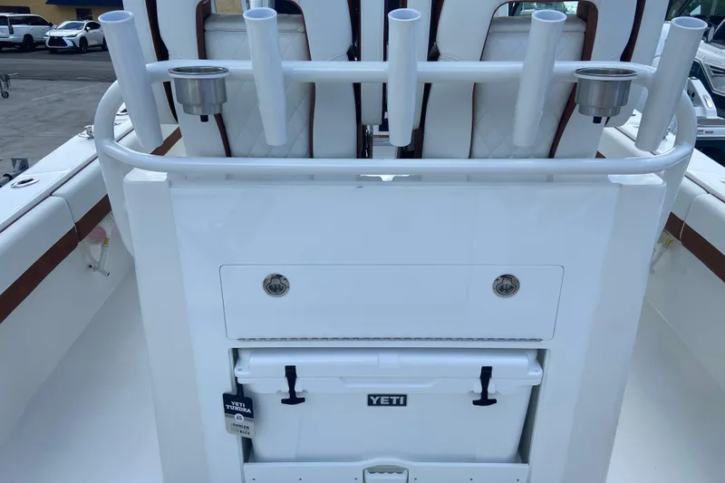 Slide: The Image of 2026 Regulator 28 boat with rod holders and Yeti cooler on deck. - 12