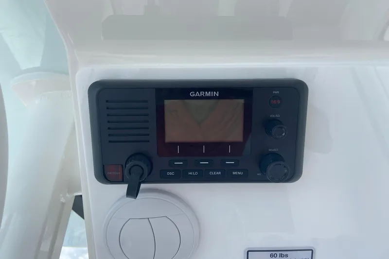 Slide: The Image of Garmin marine radio on 2026 Regulator 28 boat dashboard. - 13