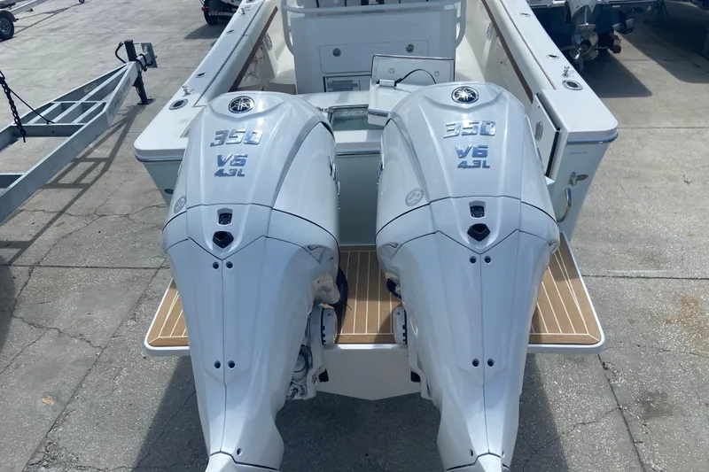 Slide: The Image of Twin Yamaha 350 V6 outboard engines on a 2026 Regulator 28 boat. - 2