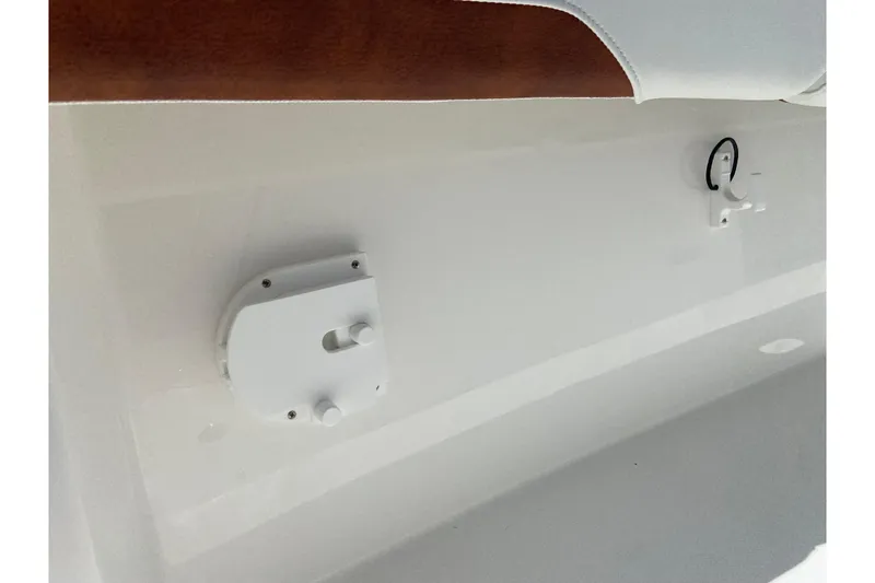 Slide: The Image of 2026 Regulator 28 boat interior detail with white fittings and upholstery. - 23