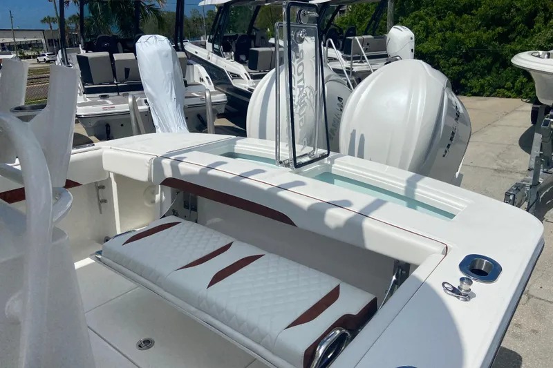 Slide: The Image of 2026 Regulator 28 boat interior with seating and dual outboard engines. - 4
