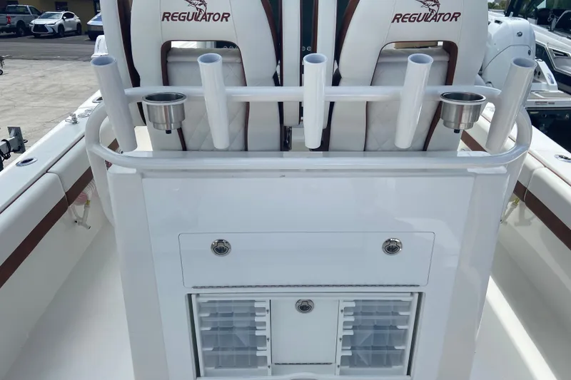 Slide: The Image of 2026 Regulator 28 boat interior with rod holders and storage compartments. - 6