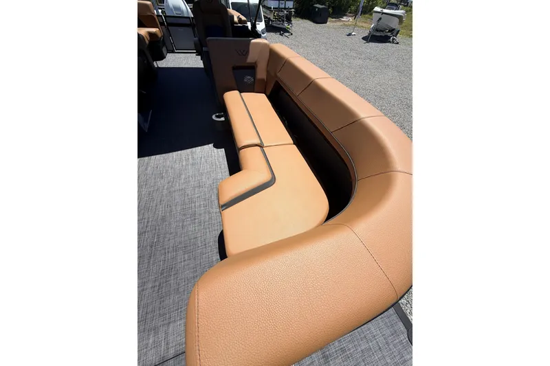 Slide: The Image of Luxurious tan seating on 2026 Whisper V23 RLS boat, featuring modern design and comfort. - 10