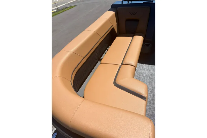 Slide: The Image of Luxurious tan leather seating in 2026 Whisper V23 RLS boat interior. - 12