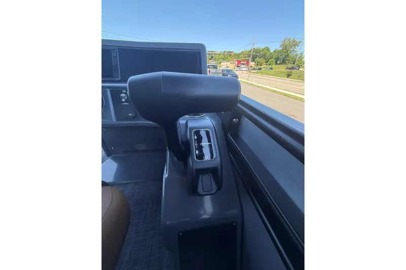 Slide: The Image of Control panel of 2026 Whisper V23 RLS boat, featuring throttle and gear lever. - 15