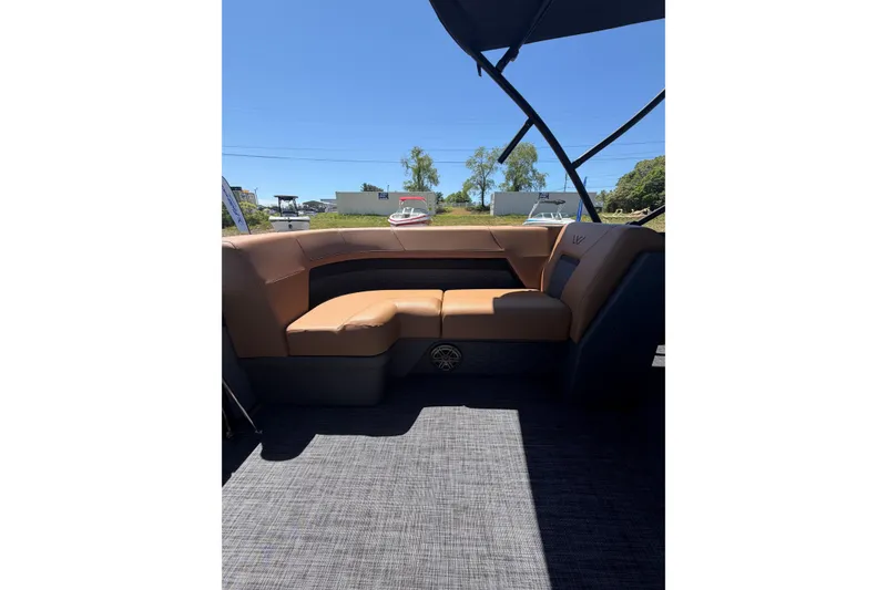 Slide: The Image of Luxurious seating inside 2026 Whisper V23 RLS boat, featuring tan upholstery and sleek design. - 20