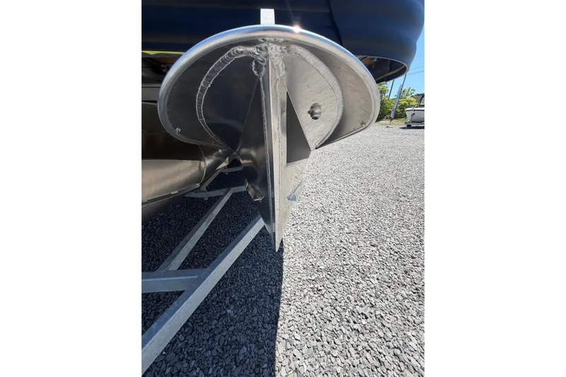 Slide: The Image of Close-up of a 2026 Whisper V23 RLS boat propeller on gravel surface. - 27