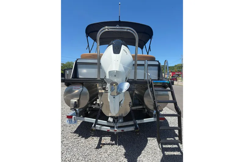 Slide: The Image of Rear view of 2026 Whisper V23 RLS boat with outboard motor and ladder. - 7