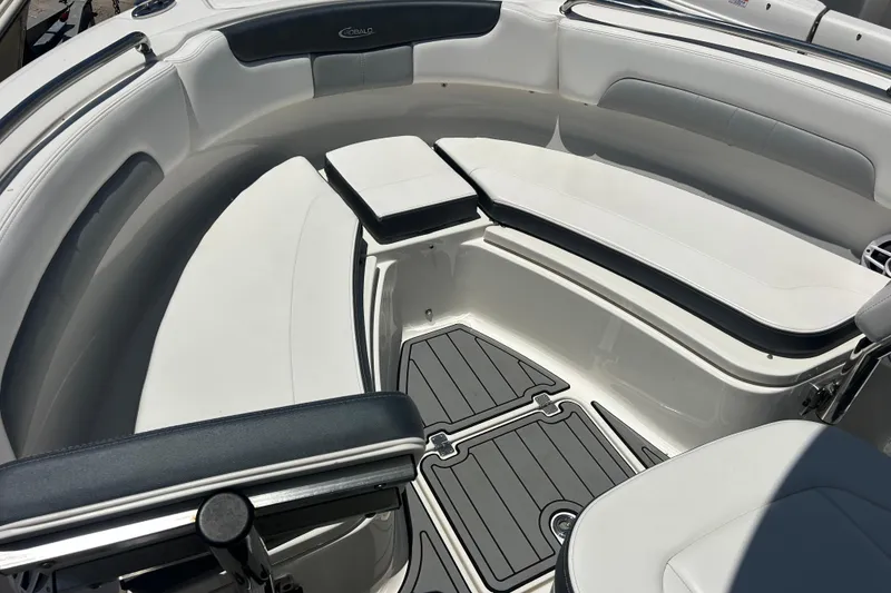 Slide: The Image of 2021 Robalo R222 Explorer boat interior with cushioned seating and non-slip flooring. - 10