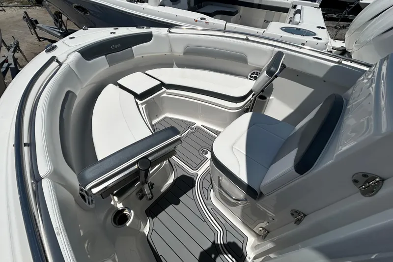 Slide: The Image of 2021 Robalo R222 Explorer boat interior with cushioned seating and sleek design. - 11