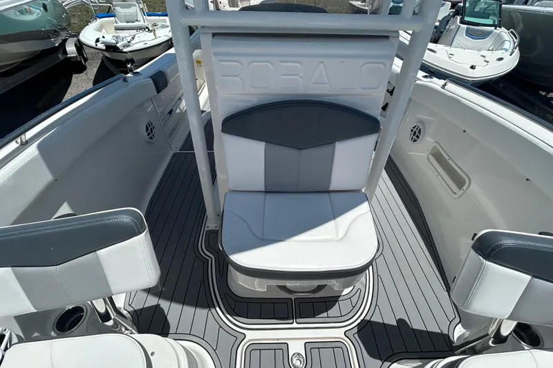 Slide: The Image of 2021 Robalo R222 Explorer boat interior with cushioned seating and sleek design. - 12