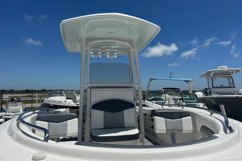 Slide: The Image of 2021 Robalo R222 Explorer boat with seating, under a clear blue sky. - 7