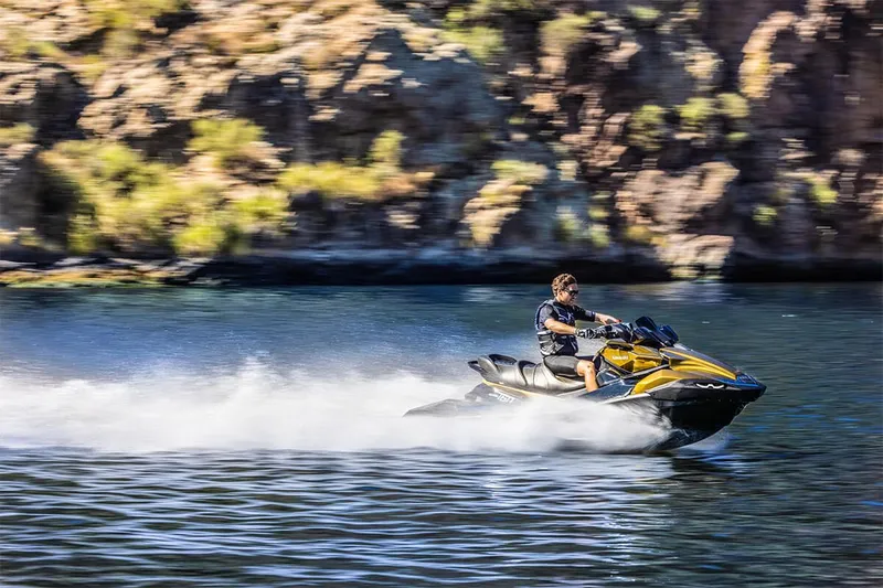 Slide: The Image of Man riding 2023 Kawasaki JET SKI ULTRA 160LX on a lake. - 11