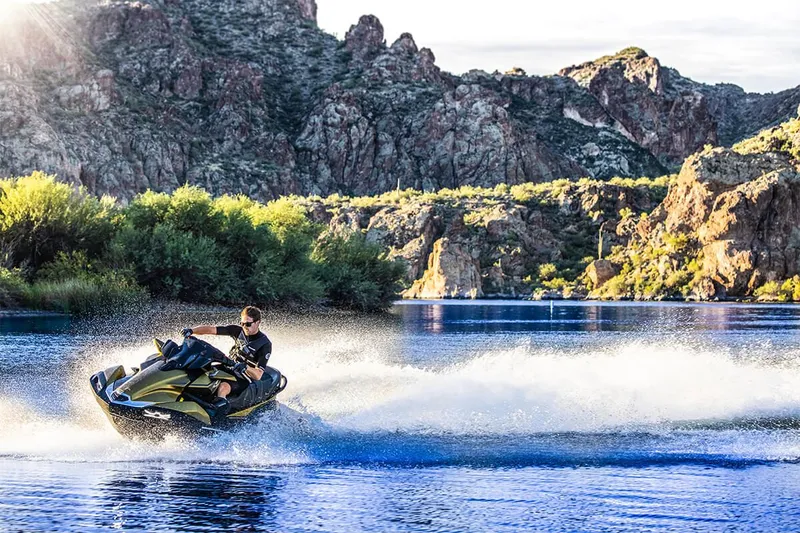 Slide: The Image of Kawasaki JET SKI ULTRA 160LX 2023 on a lake with rocky backdrop. - 12