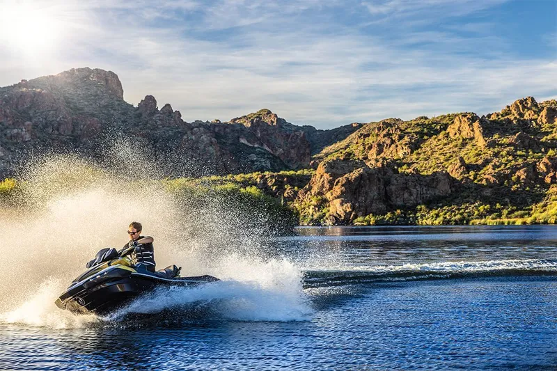 Slide: The Image of Kawasaki JET SKI ULTRA 160LX 2023 on a lake with mountain backdrop. - 14