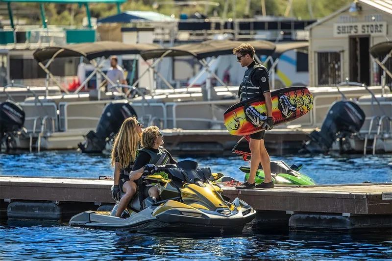 Slide: The Image of 2023 Kawasaki JET SKI ULTRA 160LX at dock with people. - 15