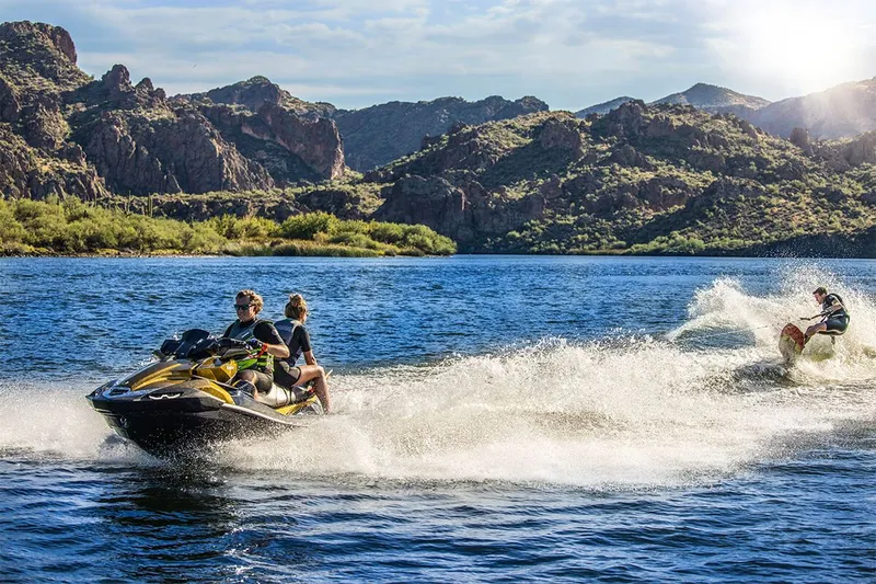 Slide: The Image of Kawasaki JET SKI ULTRA 160LX 2023 on a lake with mountains in the background. - 16