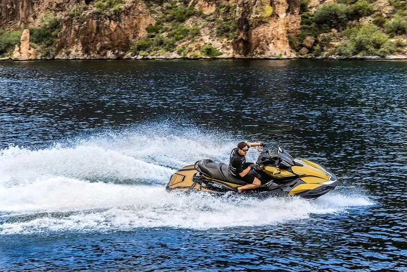 Slide: The Image of 2023 Kawasaki JET SKI ULTRA 160LX in action on a lake. - 18