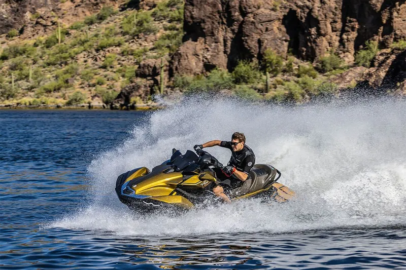 Slide: The Image of 2023 Kawasaki JET SKI ULTRA 160LX in action on a lake. - 8