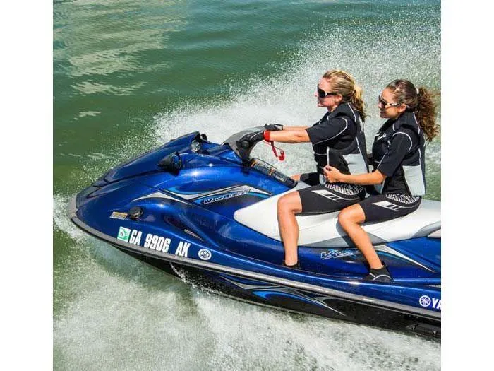 Slide: The Image of Two women riding 2014 Yamaha VX® Deluxe jet ski on water. - 7