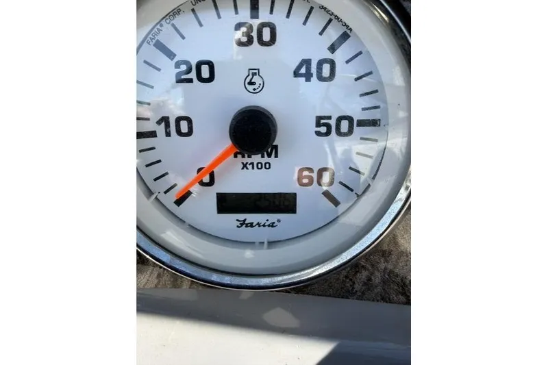 Slide: The Image of Close-up of a Faria tachometer on a 2012 Stingray 235 LR boat. - 13