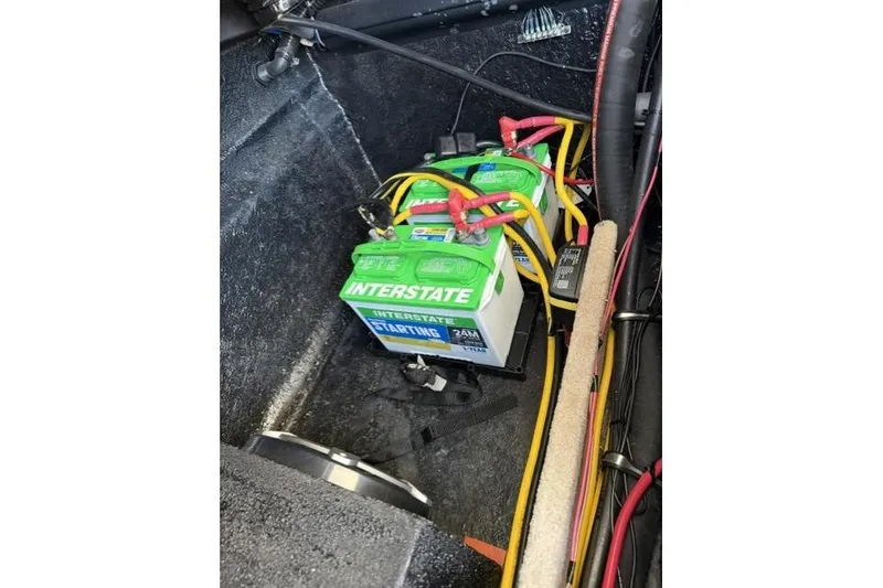 Slide: The Image of Battery compartment of a 2012 Stingray 235 LR boat with Interstate battery. - 16