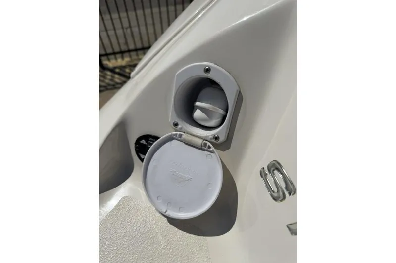 Slide: The Image of Fuel cap of a 2012 Stingray 235 LR boat, shown in close-up. - 17