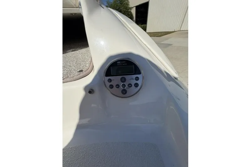 Slide: The Image of 2012 Stingray 235 LR boat dashboard with control panel in sunlight. - 20