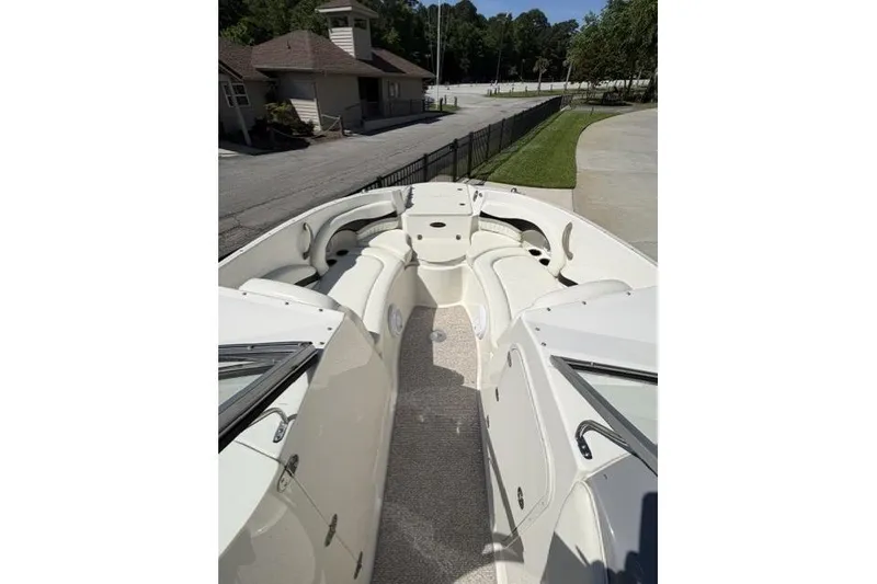 Slide: The Image of 2012 Stingray 235 LR boat interior with spacious seating and sleek design. - 9