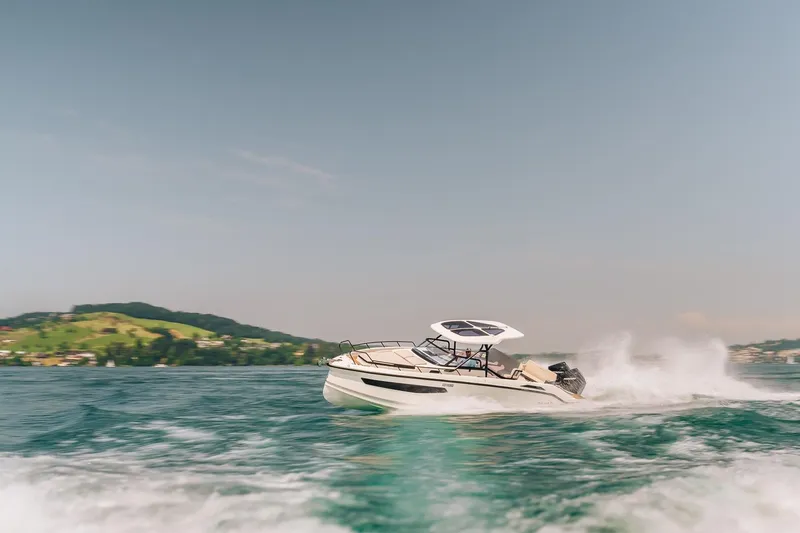 Slide: The Image of Navan S30 boat 2026 cruising on a lake. - 10