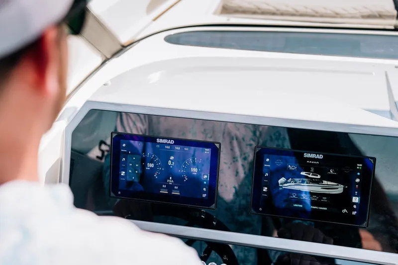 Slide: The Image of Navan S30 2026 boat dashboard with Simrad displays. - 14