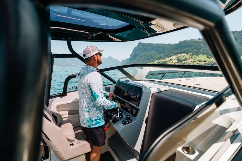 Slide: The Image of Man piloting Navan S30 boat on a lake, 2026 model. - 16