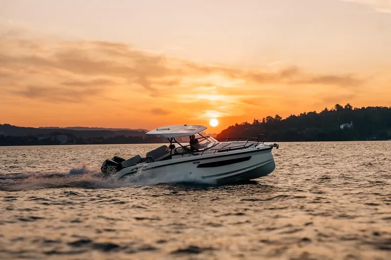 Slide: The Image of Navan S30 boat 2026 cruising at sunset on the water. - 27