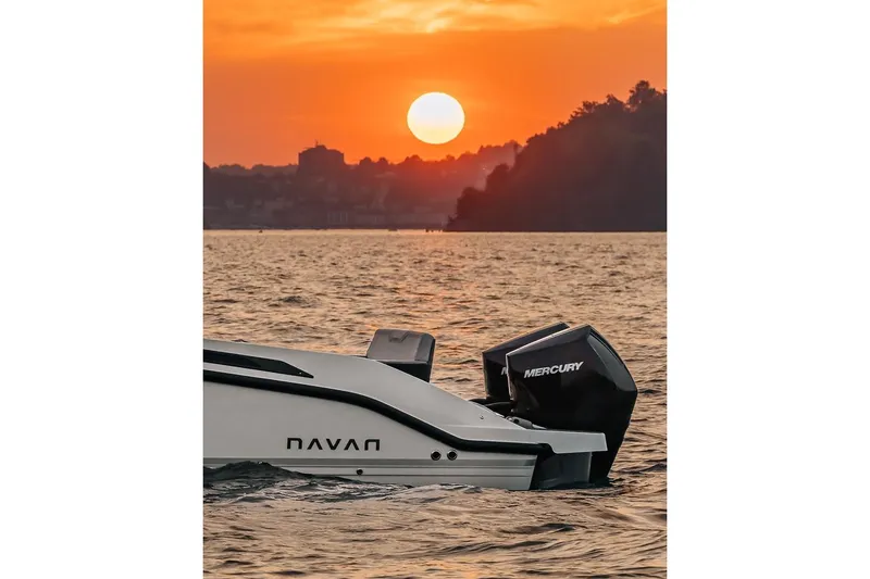 Slide: The Image of Navan S30 boat at sunset on the water, 2026 model. - 31