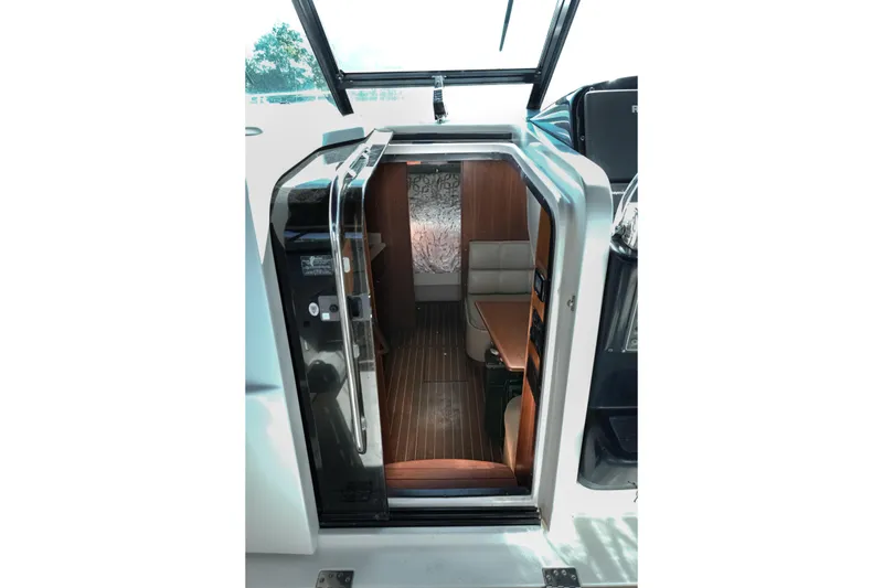 Slide: The Image of Cockpit of 1999 Tiara Yachts 3500 Open with Raymarine navigation system. - 6